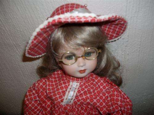 Lovely very well dressed large porcelain doll